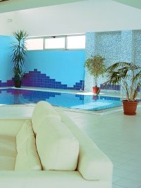 Living room with white sofas and pool